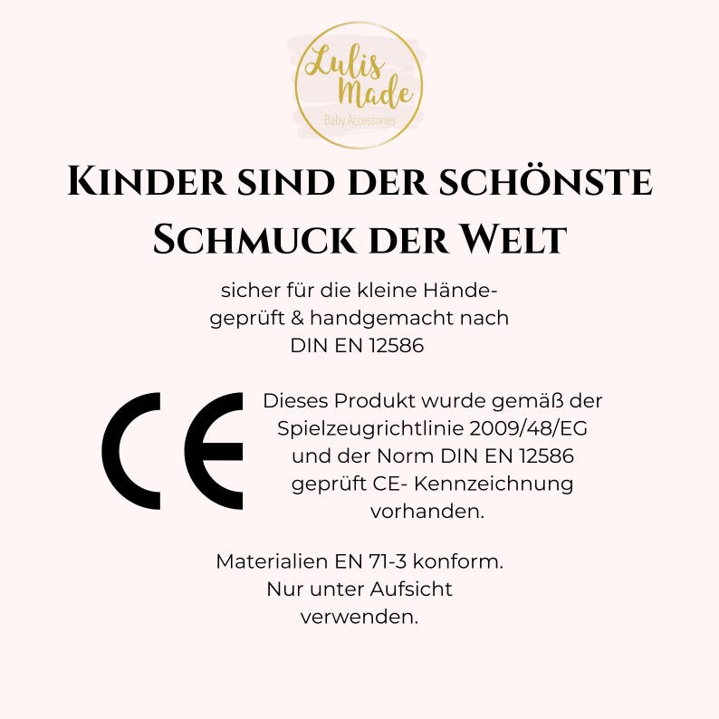 May include: A cream-colored graphic with the text "KINDER SIND DER SCH&Ouml;NSTE SCHMUCK DER WELT" and "Lulis Made Baby Accessories" in a circular logo. Includes CE marking and safety information.