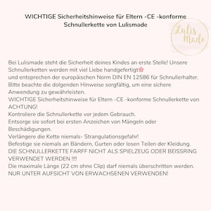 May include: A white background with German text providing safety instructions for a pacifier chain from Lulismade. The text includes warnings about strangulation and proper use. A logo with the text "Lulis Made" is in the upper right corner.