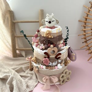 Windeltorte Mädchen, windeltorte, Personalisierte Windeltorte, Windeltorte

Eine liebevoll handgefertigte Windeltorte mit Reh in sanftem rosa- ideal für Mädchen oder als Babyparty Geschenk. Die bieten wir in drei Varianten an, die sich von der Größe und Zubehör unterscheiden. 

Wunderschöne Windeltorte mit Rehkitz für dein kleines Wunder! 💫