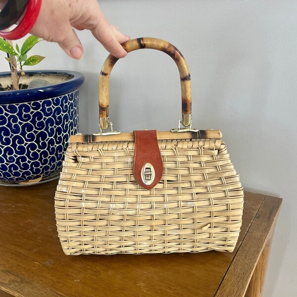 1950's light tan coated bamboo basket bag with leather strap twist closure, paisley print lining generous size great condition