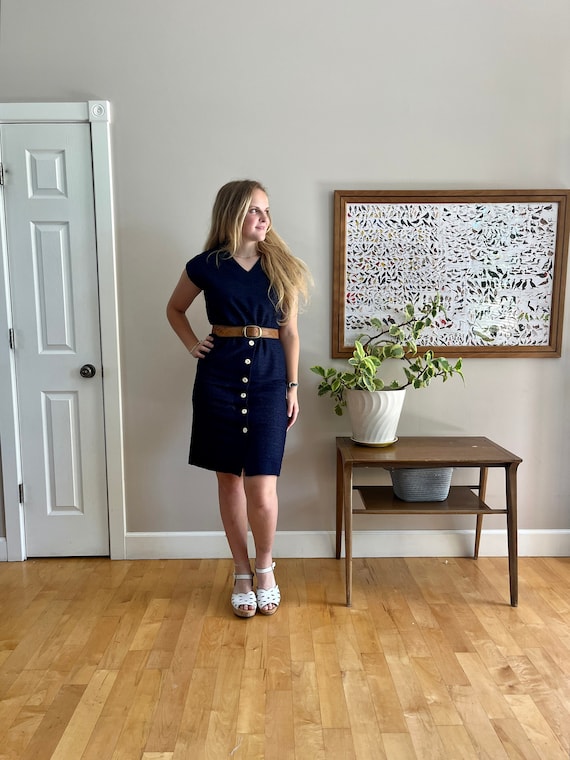 Early 1970's navy blue wiggle dress w/cream buttons, cool textured stretch fabric wide v-neck Kevin Stuart excellent condition size M Early 1970's navy blue wiggle dress w/cream buttons, cool textured stretch fabric wide v-neck Kevin Stuart excellent condition size M