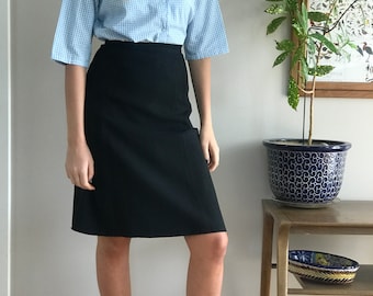 1950's black wool/rayon blend a-line skirt, cut in panels, talon metal side zipper, classic timeless design excellent condition size XS