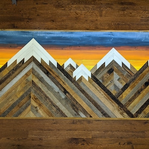Rustic mountain wood wall art asymetrical with sunrise. Hand crafted from reclaimed wood by DoxaDesign