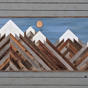 Rustic mountain wood wall art  asymmetrical peaks with daytime sky. Hand crafted from reclaimed wood by DoxaDesign