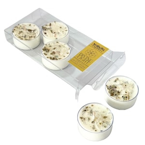 May include: A pack of four white tea and crystal infused tea light candles in a clear plastic container. The label reads "Arabella Crystals Divine Light White Tea & Crystal Infused Tea Light Candles".