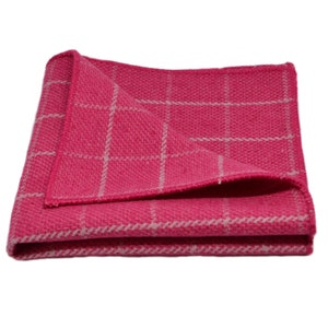 May include: A pink and white checkered pocket square. The pocket square is folded and has a soft, textured feel.