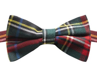 May include: A red, green, yellow, and white plaid bow tie.