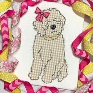 May include: A white, fluffy dog with a pink bow on its head. The dog is sitting with its paws crossed and has a yellow collar. The dog is on a white background.