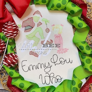 May include: Embroidered design of the Grinch and Cindy Lou Who on a white fabric background. The design is in green, pink, and white thread. The text "Emmy Lou Who" is embroidered below the design.