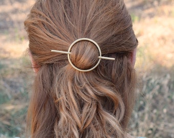 Brass circle hair barrette with brass stick