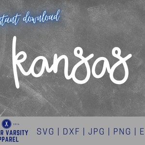 May include: White cursive text on a gray background that reads "kansas". The text is in a handwritten style. Below the text is a white rectangle with the text "JUNIOR VARSITY APPAREL" in blue text. Below that is a white rectangle with the text "SVG | DXF | JPG | PNG | EPS" in blue text.