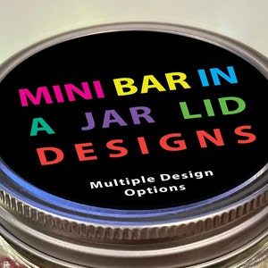 May include: A black jar lid with the text "MINI BAR IN A JAR LID DESIGNS" in rainbow colors. The text "Multiple Design Options" is printed in white below the rainbow text.