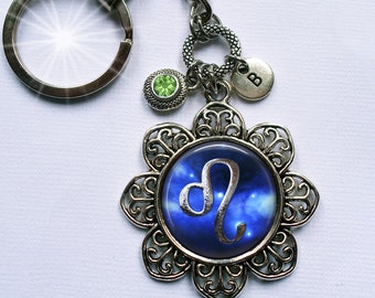 Llavero o clip con el símbolo de Leo, con cristal brillante de piedra natal y dije de letra a tu elección, signo zodiacal, del 23 de julio al 23 de agosto.