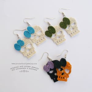 May include: Crocheted skull earrings with bows in various colors, including green, blue, and purple. The earrings are handmade and feature a delicate, intricate design.  www.crochetknitjewelry.com original and unique jewelry for crocheters & knitters