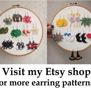 May include: A collection of crocheted earrings displayed on two embroidery hoops. The earrings feature various designs, including a cactus, a heart, a skull, a witch's hat, and a fairy. The text "Visit my Etsy shop for more earring patterns" is displayed below the hoops.