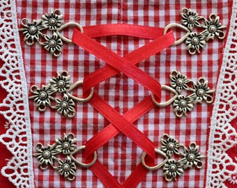 Metalen lijfje oogjes, dirndl oogjes, lijfje haken, veteroogjes, klederdrachtknopen, Middeleeuwen, Oktoberfest, Beieren, dirndl, lijfje oogjes