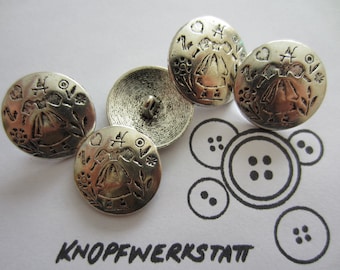 May include: Four silver-toned buttons with a raised design of a girl in a dress and flowers. The buttons are round and have a hole in the center. The text "KNOFFWERKSTATT" is written on the white background.