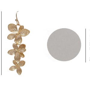 May include: Gold-toned floral drop earrings. The earrings are 49mm (1.9 inches) long and feature three flower-shaped pendants. A US quarter dollar size is 24mm (0.95 inches).