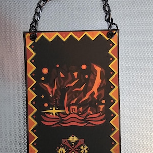 May include: A black and orange banner with a chain hanging from the top. The banner features a red and orange creature with a yellow star in the center. The creature is surrounded by a red and orange wave pattern. The banner also features a black and yellow symbol in the bottom center.