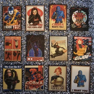 May include: A set of twelve retro posters, featuring characters and slogans from the G.I. Joe and Cobra franchises. The posters use a vintage style with bold colours and text, including phrases such as "I Want You!" and "Cobra Wants You!"