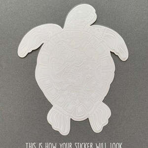 May include: White sticker of a detailed turtle design. The sticker is on a gray background. This is how your sticker will look when it arrives in your mailbox and before you peel off the backing.