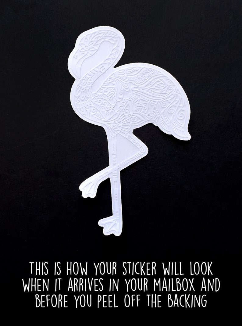 May include: White flamingo sticker with intricate etched details, set against a black background. The sticker's design features a detailed pattern. Text at the bottom reads: "THIS IS HOW YOUR STICKER WILL LOOK WHEN IT ARRIVES IN YOUR MAILBOX AND BEFORE YOU PEEL OFF THE BACKING."