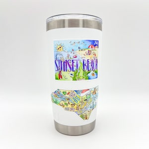 May include: A white insulated tumbler with a silver rim and lid. The tumbler features two colorful stickers. The top sticker says "Sunset Beach" with a beach scene. The bottom sticker is a map of the area.