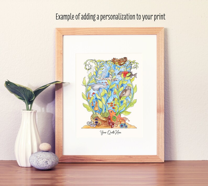 May include: A framed watercolour illustration of an underwater scene with a variety of sea creatures, including fish, a dolphin, a seahorse, and an octopus. The illustration is surrounded by green seaweed and has the text "Your Quote Here" at the bottom.