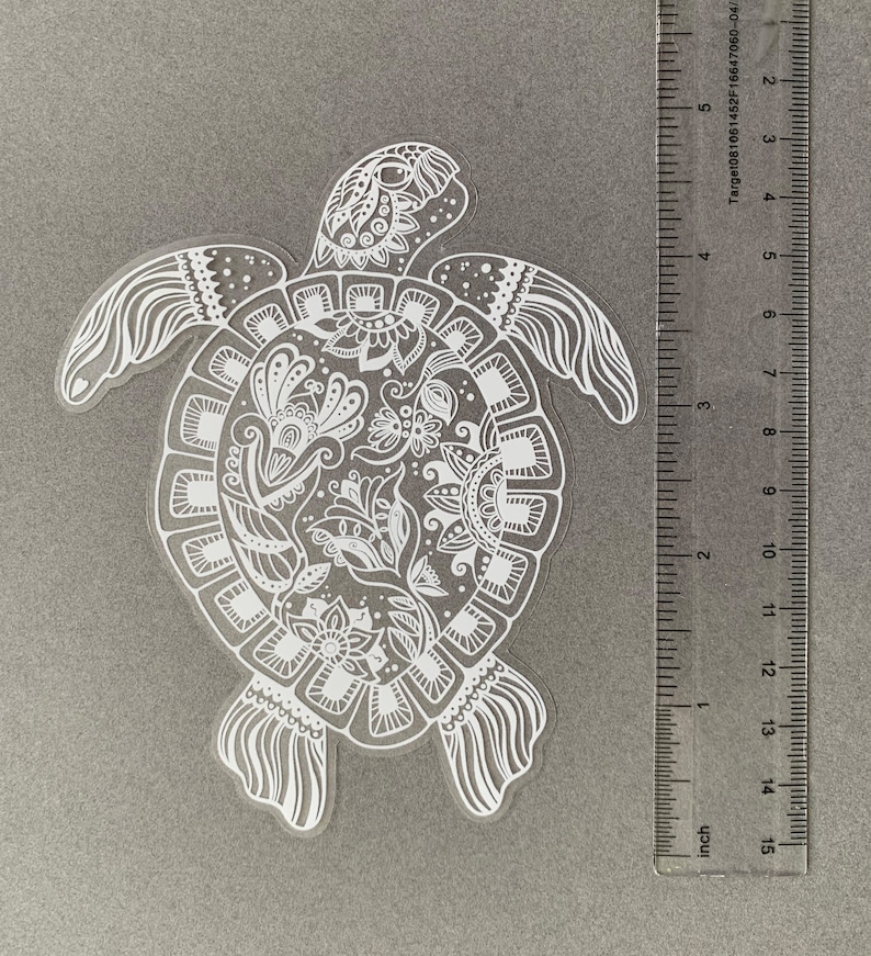 May include: White vinyl sticker of a detailed mandala-style turtle design.