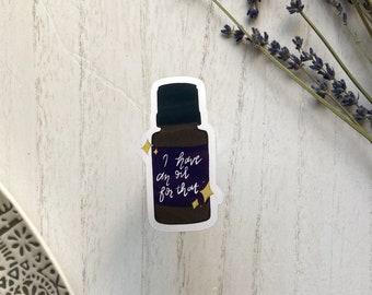 May include: A sticker of a brown glass bottle with a purple label that says "I have an oil for that". The bottle has a black cap and is surrounded by gold stars.