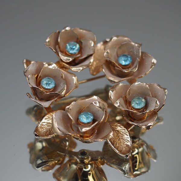 Glowing Vintage Coro Circle Brooch with Soft Aquamarine Rhinestone Centered Enamel Flowers