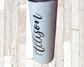May include: White stainless steel tumbler with a pink glitter design and the name "Allison" written in black cursive.