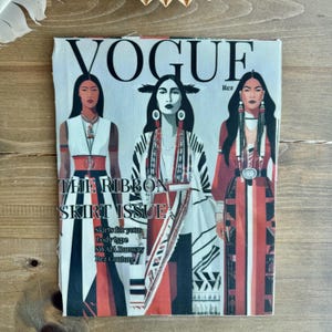 May include: A Vogue magazine cover featuring three women in traditional Native American attire. The cover text reads "THE RIBBON SKIRT ISSUE" with additional text about skirt styles and a runway. The color palette includes red, black, white, and tan.