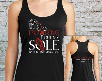 May include: A black racerback tank top featuring a graphic of a wine bottle pouring into a glass shaped like a mouse head, with the text "POURING OUT MY SOLE TO THIS HALF MARATHON". The back displays "DISNEY WINE & DINE HALF MARATHON 2026".