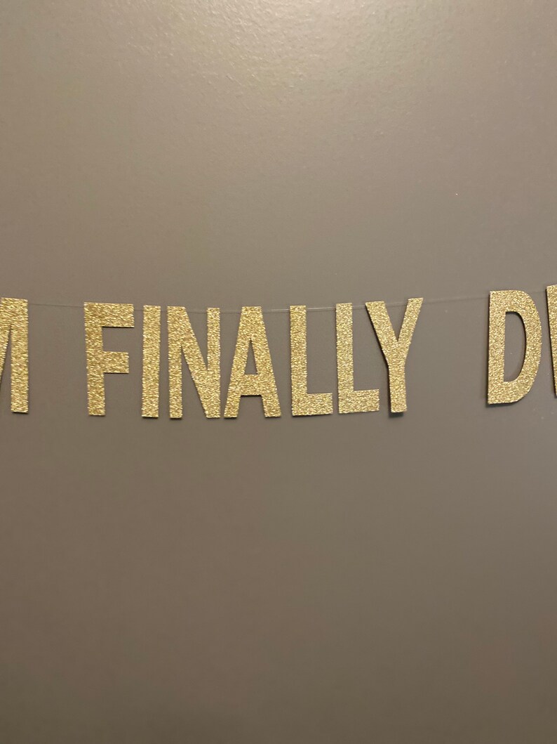 May include: Gold glitter banner with the text "I FINALLY DID IT".