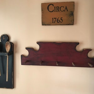 Primitive colonial style peg rack