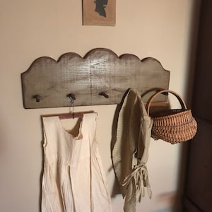 Primitive colonial round top scalloped peg rack