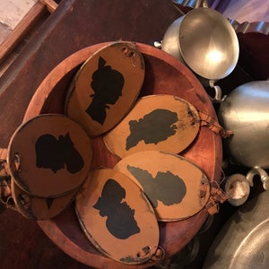 Primitive colonial style silhouette ornaments, crock tags