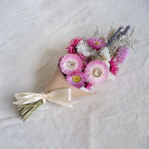 Pink and purple dried flower arrangement image 1