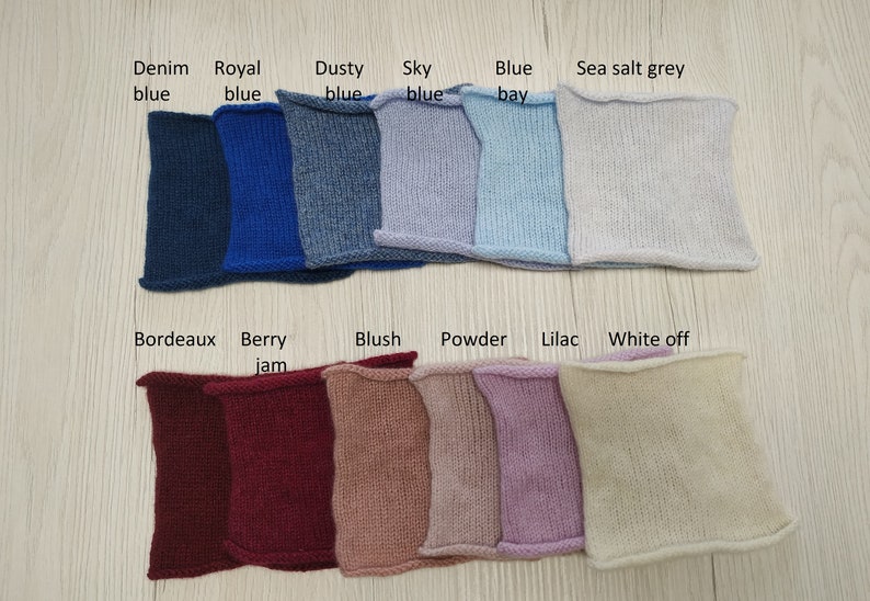 May include: Swatch cards showing 12 different knit fabric colors. The colors are: Denim blue, Royal blue, Dusty blue, Sky blue, Blue bay, Sea salt grey, Bordeaux, Berry jam, Blush, Powder, Lilac, and White off.