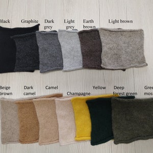 May include: Swatch card of 14 different knit fabric colors. The colors are: black, graphite, dark grey, light grey, earth brown, light brown, beige brown, dark camel, camel, champagne, yellow, deep forest green, and green moss.