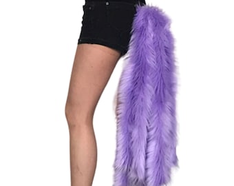 May include: A long, fluffy purple tail costume accessory. The tail is made of soft, faux fur and is attached to a belt.
