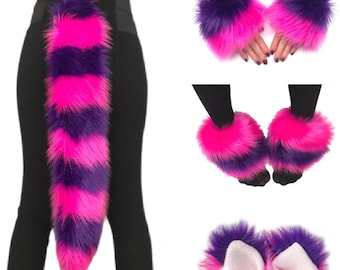 May include: A set of faux fur accessories featuring a long tail, wrist cuffs, leg warmers, and ear headbands. Each piece is crafted from long, shaggy synthetic fur with alternating horizontal stripes of vibrant hot pink and deep purple.