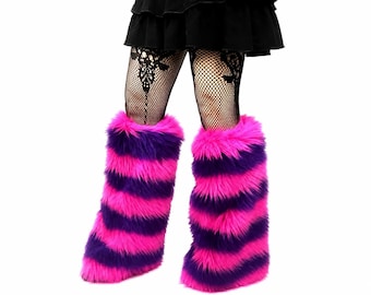 May include: A pair of leg warmers made of long, shaggy faux fur featuring horizontal stripes in alternating bright neon pink and deep purple. The leg warmers are worn over black fishnet stockings and a black skirt, extending from the mid-calf down.