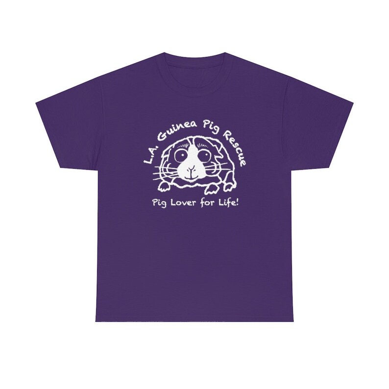 May include: A purple t-shirt featuring a white graphic of a guinea pig with the text "L.A. Guinea Pig Rescue" and "Pig Lover for Life!" in a circular design. The design is centered on the front of the shirt.