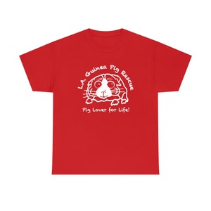 May include: A red t-shirt featuring a white graphic of a guinea pig with the text "L.A. Guinea Pig Rescue" and "Pig Lover for Life!". The design is centered on the front of the shirt.