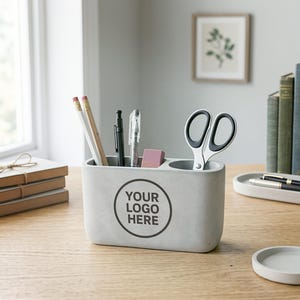 May include: A set of three ceramic mugs with a speckled, matte finish. The mugs are in shades of cream, light gray, and dark gray. Each mug has a simple, minimalist design and a rounded handle.
