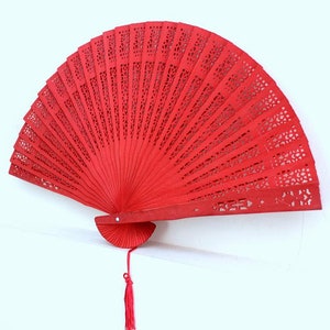 red handfan made of sandelwood image 1