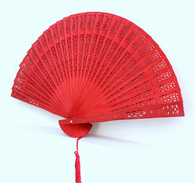 red handfan made of sandelwood image 1