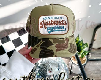 Looks Like My Husband’s Problem Trucker Hat – Funny Wife Hat | Sassy Otto Cap |Hot Girl Humor Hat | Baddie Trucker Hat